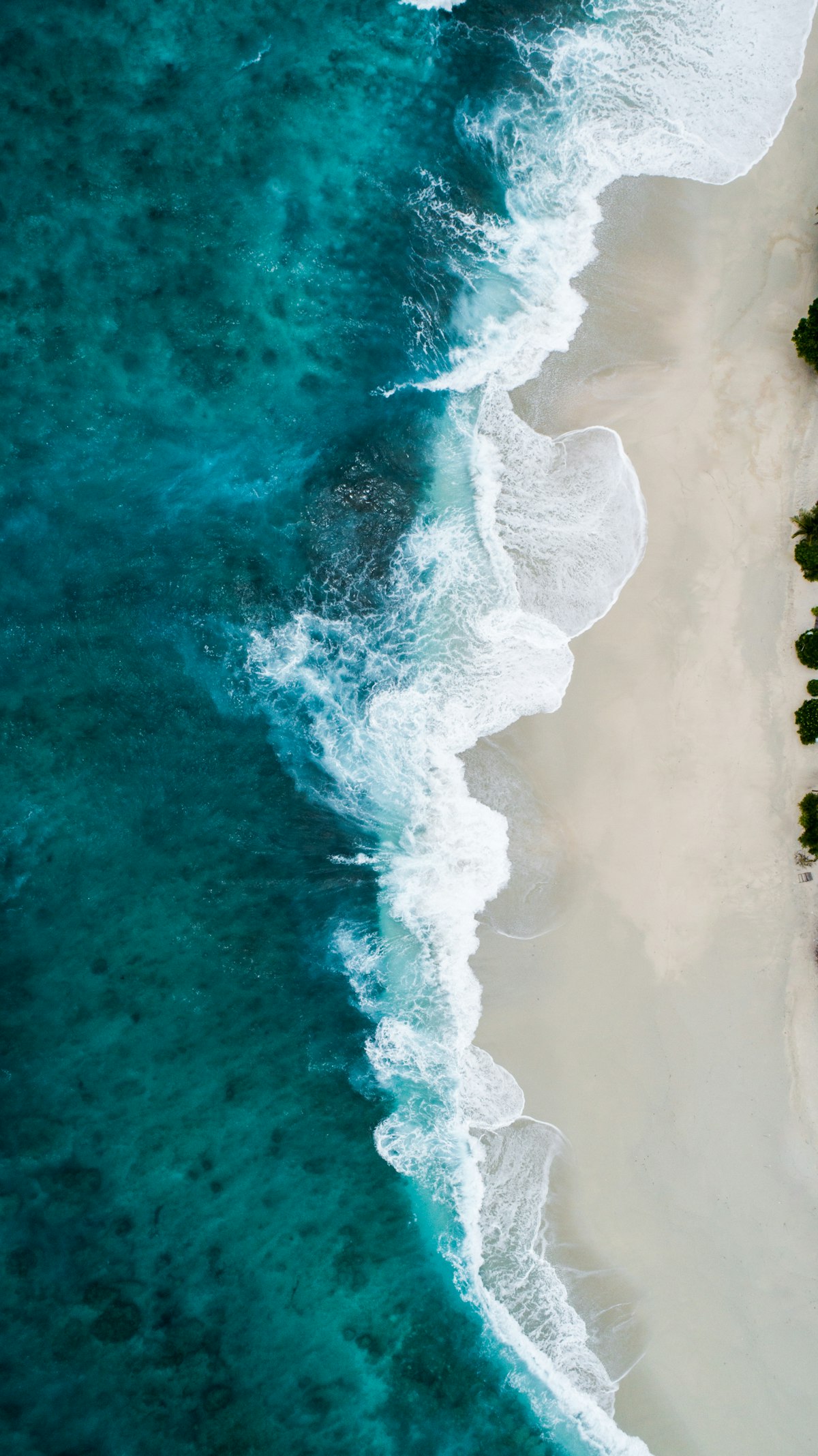 Ocean waves breaking on shore — constant retrieval, constant flow